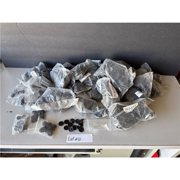 13: Box of plastic grommets