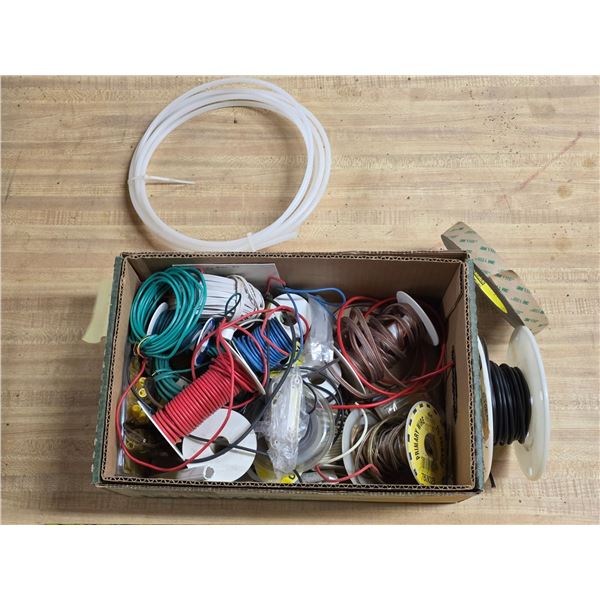 Box of various spools of wires and hardware