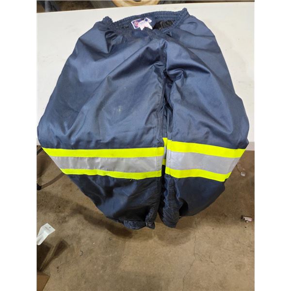 Large rain pants and chainsaw pants