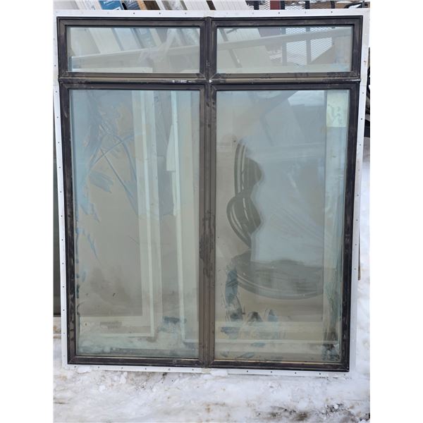 Commercial/ housing window in a black frame- used- 60" by 74"H
