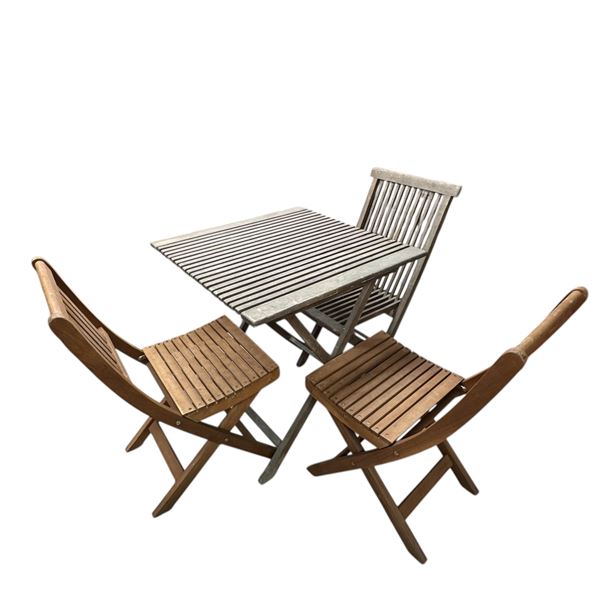 Outdoor Teak Folding Table and Mismatched Chairs