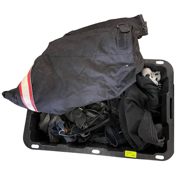Container Filled with Assorted Jeans and a Motorcycle Jacket