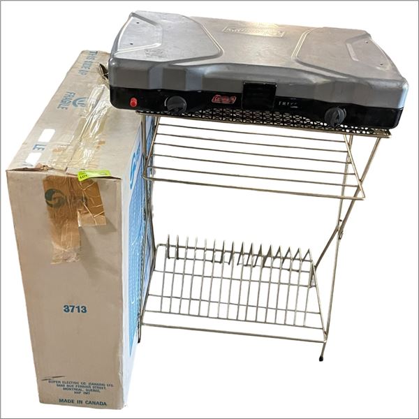 Box Fan, Brass Magazine Stand and Coleman Stove