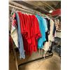 Image 1 : Full Rack of Apparel: Denim, Red Polos, Mixed Tops, and More (Rack Not Included)