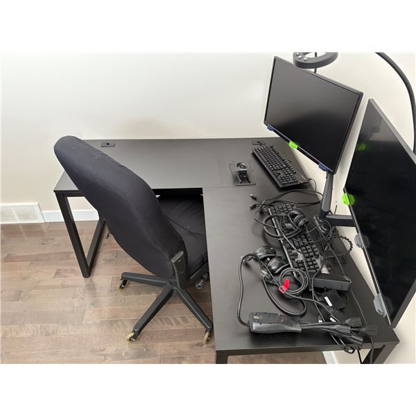 Office desk with chair and computer monitors