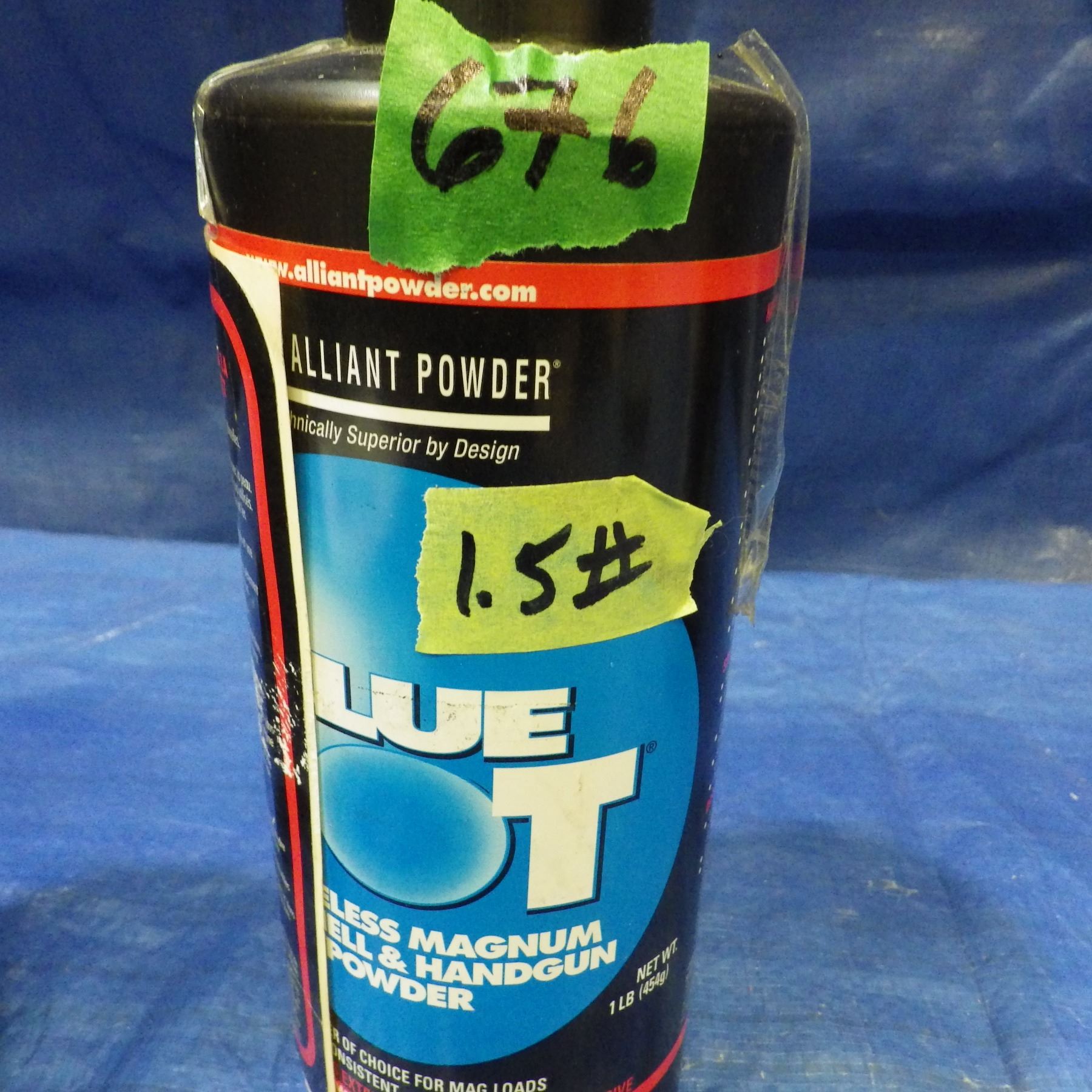 CAN OF POWDER from an estate. Total weight noted is for container and ...