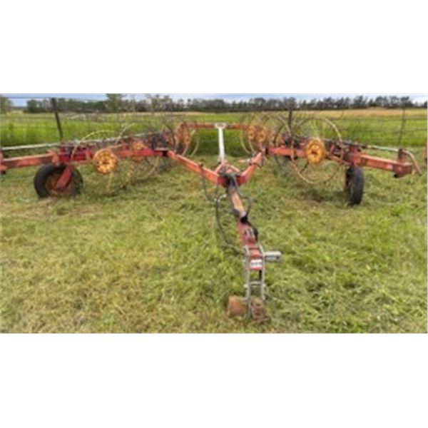 V-Hay rake Tonutti, 10 wheel, approx. 24 ft wide, no visible serial #. The Estate of Clarence Ewasiw