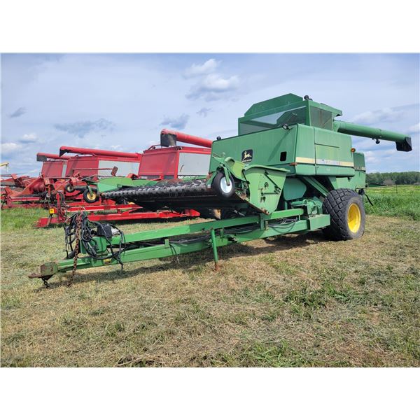 JD 7721 Pull Type Combine, hyd. PTO, Goodyear 23.1-20 rubber on 20 inch rims. Located at 23012 Twp 6