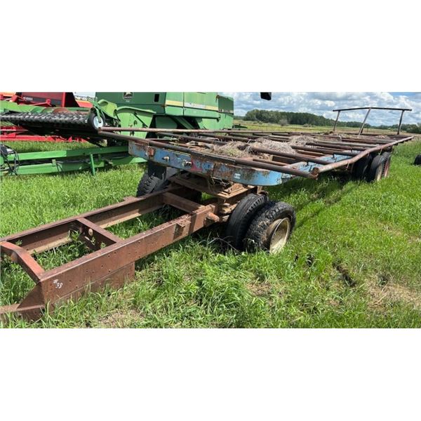 Pull type hay wagon, 36 ft c/w converter, farm use only. Tires and tarp do not go w/trailer.Located