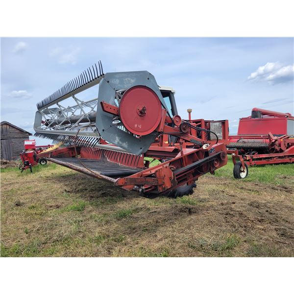 Hesston 8100 21ft Swather, gas, showing 2297 hrs, left door & front glass are missing, runs, SN. 810