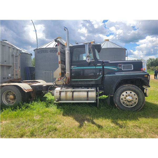 1984 Ford LTL 9000 Semi tandem axle truck. 8 spd Cummins engine. Showing 597521 km motor miles. VIN