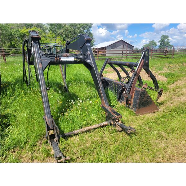 Ezee-on loader w/ 7ft grapple bucket. Located at 23012 Twp 604, North West of Thorhild. Viewing is J