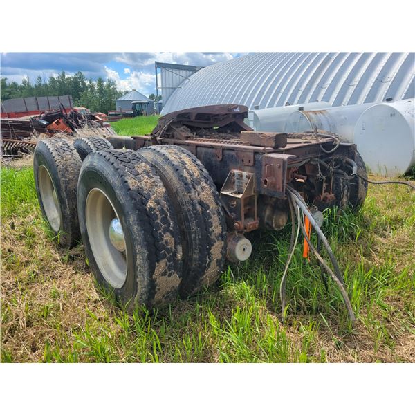 Back 1/2 of a semi off 11R 24.5 Tandem axles & frame from a Freightliner semi truck. Located at 2301