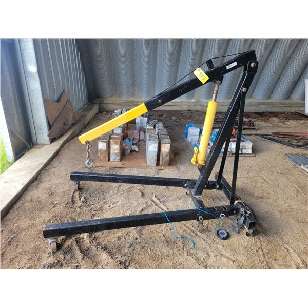 Power fist folding shop crane. 8 ton capacity, long stroke jack.   Located at 23012 Twp 604, North W