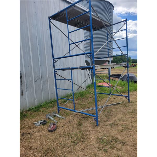 Scaffolding- two levels with two platforms, two legs and 2 wheels.   Located at 23012 Twp 604, North