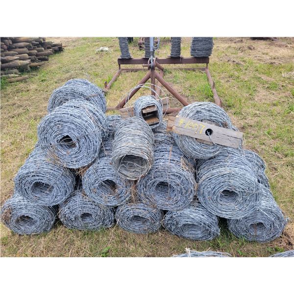 Chain-link fence, barb wire fence rolls- 22 rolls, zinc coated, one foot tall rolls.   Located at 23