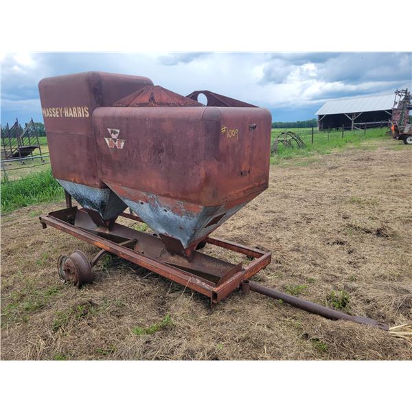 Homemade trailer mounted double hopper self feeder for animals.   Located at 23012 Twp 604, North We