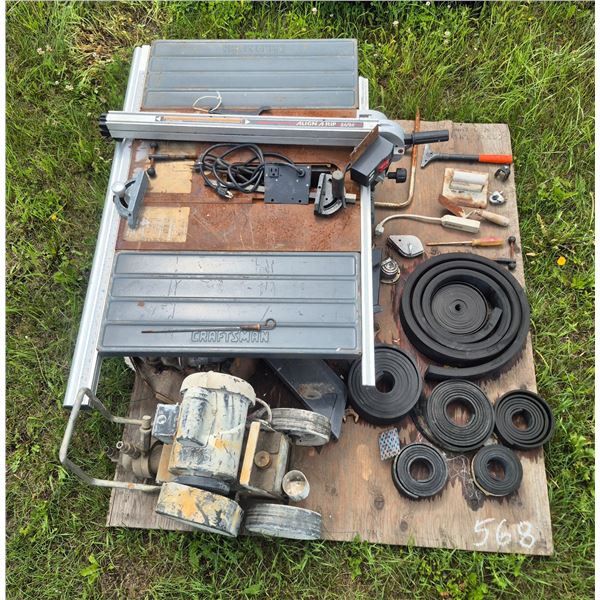 Craftsman's table saw, elec. pump, various rubber belting, trailer hitch, misc. tools etc.