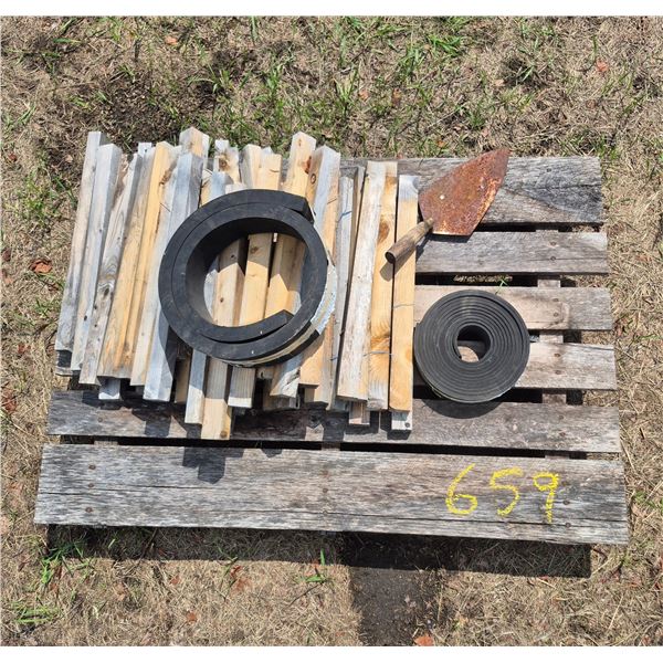 Pallet of wood stakes, cement trowel, 2 small rolls of belting