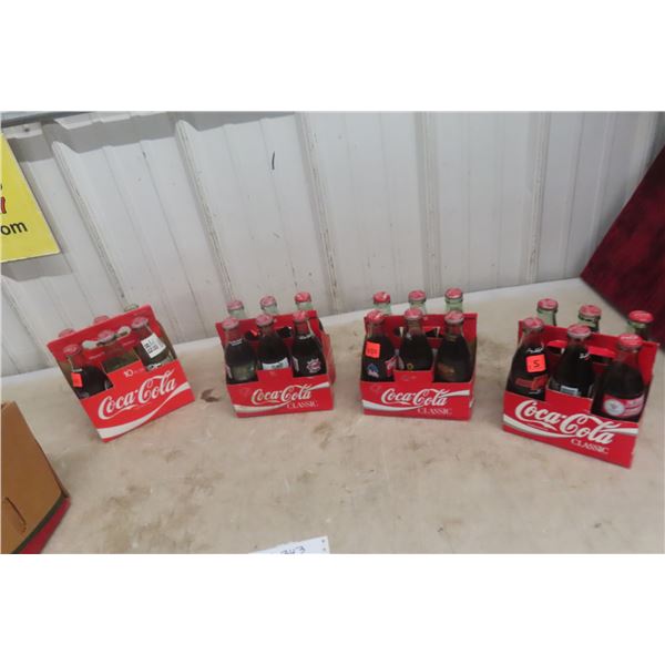 20 Full Coke Bottles, 4 Empty, 4 Cardboard Carriers +