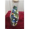 Image 1 : Cream Bottle Full of Marbles