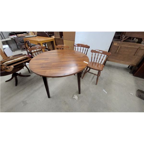 Oval Drop-Leaf Dining Table with Trestle Base and Four Windsor-Style Spindle-Back Chairs Extended
