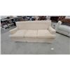 Image 1 : Cream/Beige Upholstered Three-Seater Sofa with Button-Tufted Back and Removable Seat Cushions 72"