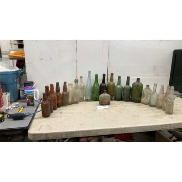 Collection of Vintage Glass Bottles in Assorted Colors and Sizes