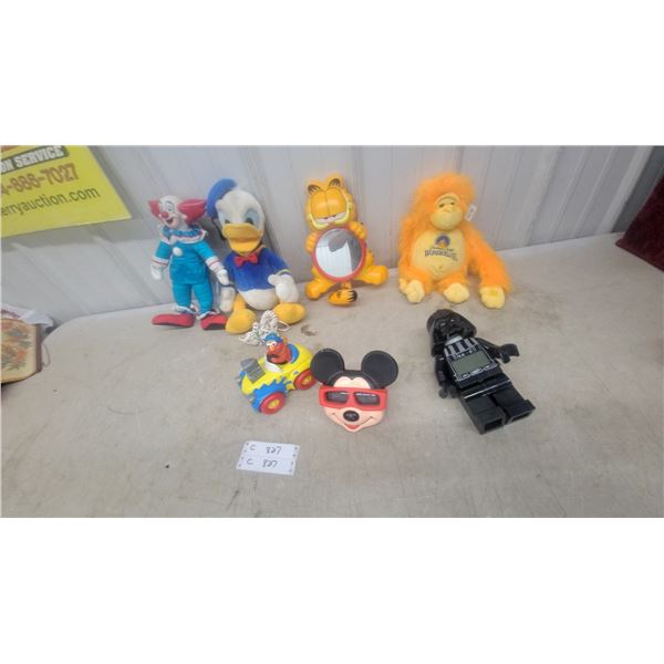Vintage Character Toys Including Donald Duck Phone, Garfield Mirror, Bozo Doll, and More