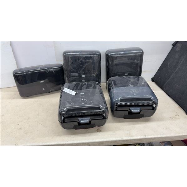 4 Tork Matic Hand Towel Dispensers and 1 Tork Toilet Paper Dispenser