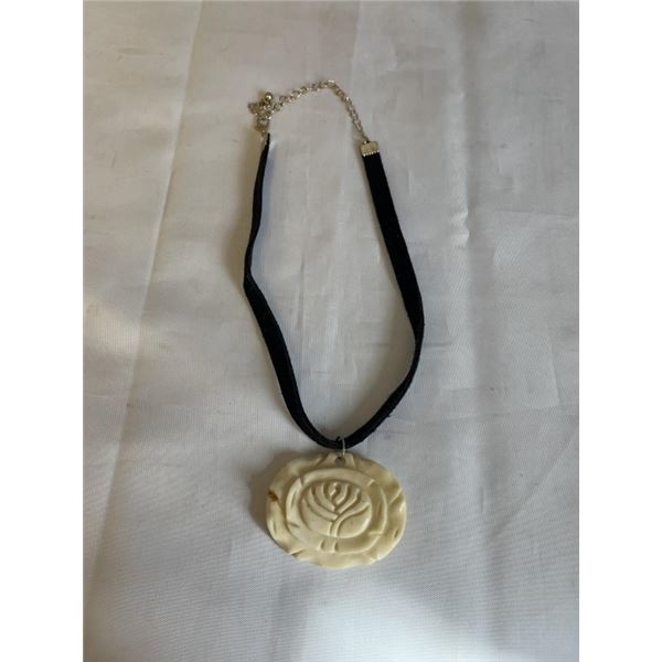 VINTAGE HAND CARVED BONE OR IVORY PENDANT W/ BLACK CORD NECKLACE