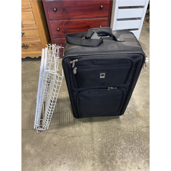 BLACK SUITCASE AND WHITE METAL SHOE RACK