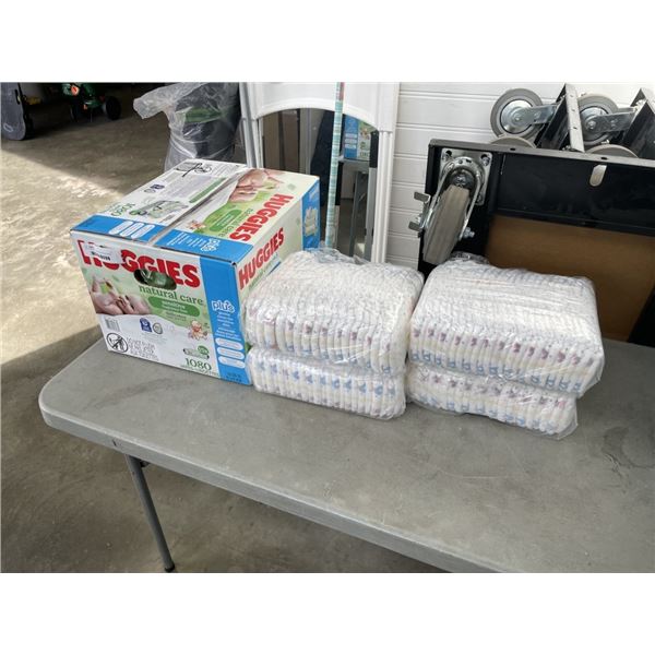 HALF BOX OF HUGGIES SENSITIVE WIPES AND 5 PACKS OF SIZE 5 DIAPERS