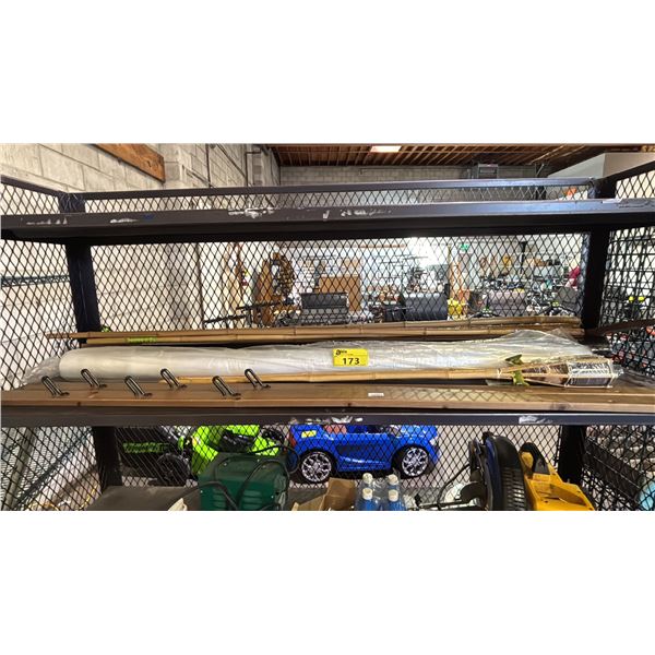 SHELF OF TIKI TORCHES, BAMBOO POLES, ROLL OF PLASTIC SHEETING & MORE
