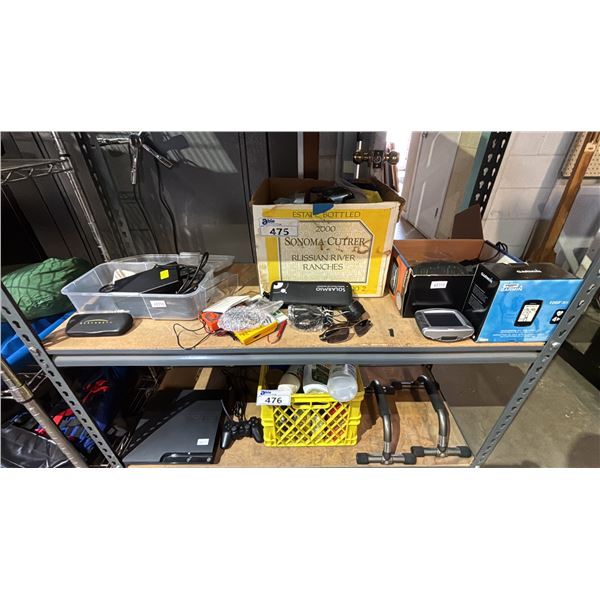 SHELF OF ASSORTED ITEMS INCLUDING; PRADA SUNGLASSES, GARMIN NAVIGATION TOOL, SOLAR PANEL & MORE