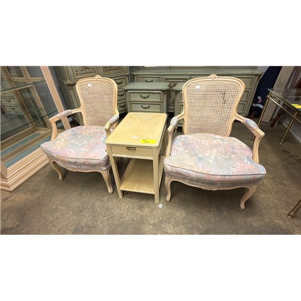 PAIR OF CANE BACK FABRIC ARM CHAIRS & 2-TIER 1-DRAWER END TABLE (SOME CHAIR DAMAGE)