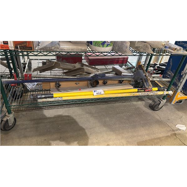 SHELF OF ASSORTED CLEANING TOOLS: MOP, EXTENSION POLES & MORE