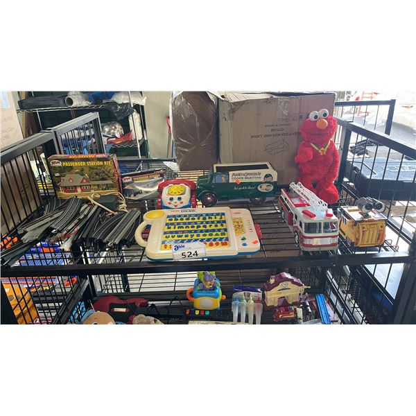 SHELF OF ASSORTED TOYS: MODEL TRAIN TRACKS, WALL-E TOY, LITTLE ALPHABET SMART DESK & MORE
