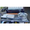 Image 2 : GREY METAL 2 TIER SHOP TABLE WITH ASSORTED FOLDING STEPS, VEHICLE RIM, SHOVELS, PAIL OF INDUSTRIAL