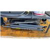 Image 4 : GREY METAL 2 TIER SHOP TABLE WITH ASSORTED FOLDING STEPS, VEHICLE RIM, SHOVELS, PAIL OF INDUSTRIAL