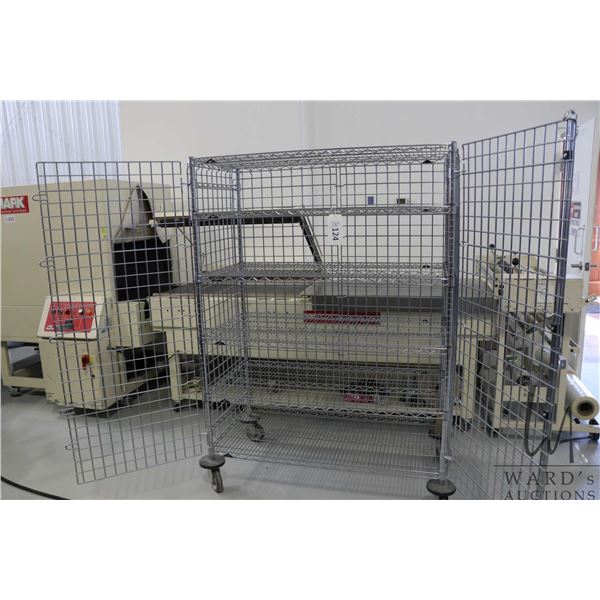 Heavy duty two door, lockable cabinet on castors, four shelves, 68"h x 29"w x 25"d.