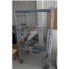 Image 1 : Heavy duty two door, lockable cabinet on castors, two shelves, 68"h x 38"w x 25"d.
