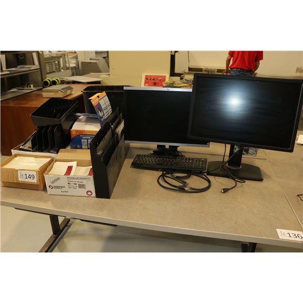 Selection of office supplies including two monitors, desk organization, GL570 printer, tape guns, et