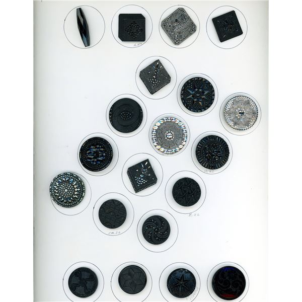 A CARD OF DIVISION ONE ASSORTED BLACK GLASS BUTTONS