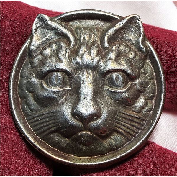 A DIVISION THREE METAL CAT BUTTON