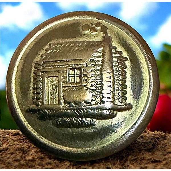 A DIVISION ONE BRASS ARCHITECTURAL BUTTON