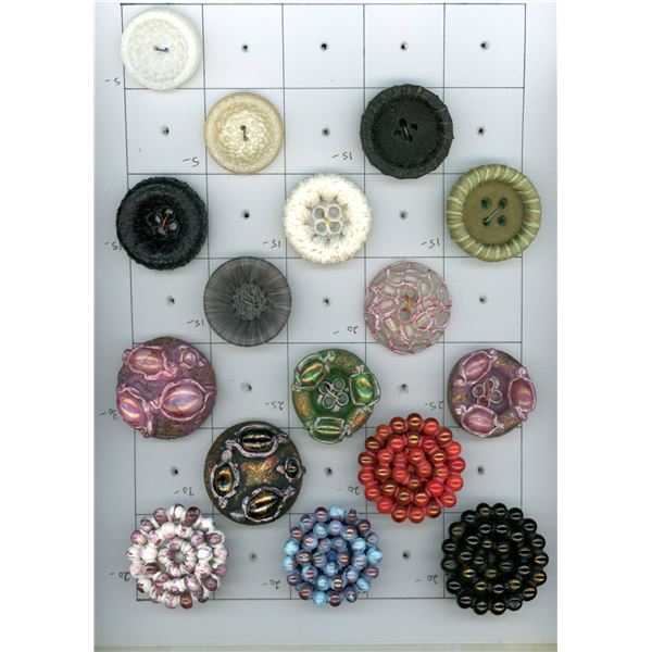 A CARD OF DIVISION THREE COUTURE STUDIO BUTTON