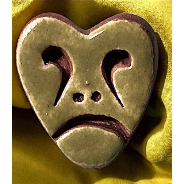 A DIVISION THREE PICTORIAL CERAMIC BUTTOIN