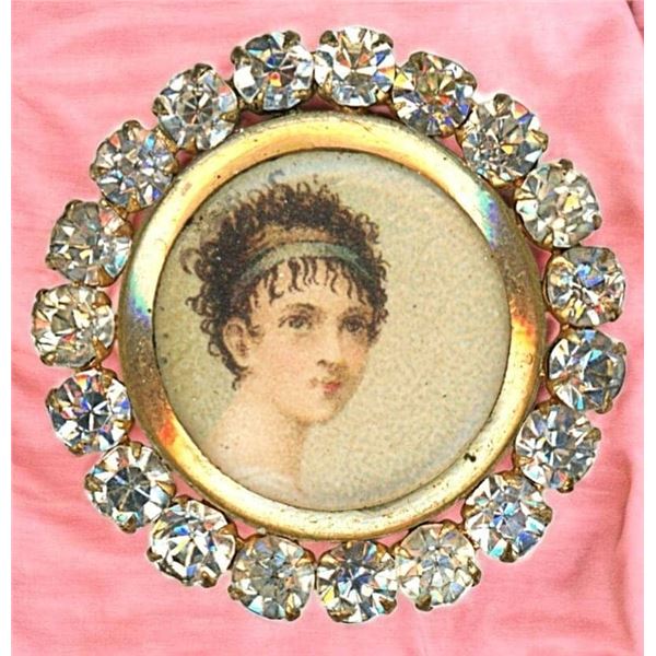 A DIVISION ONE UNDER GLASS FEMALE BUTTON