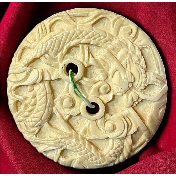 A DIVISION ONE HAND CARVED DRAGON BUTTON
